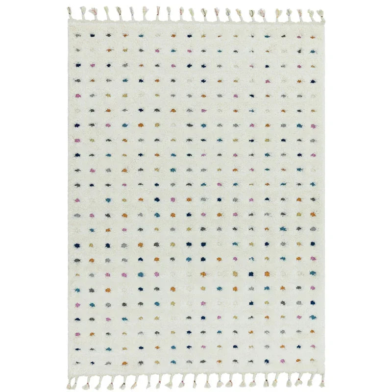 white wool rug with multicolour dot pattern and fringe on both ends