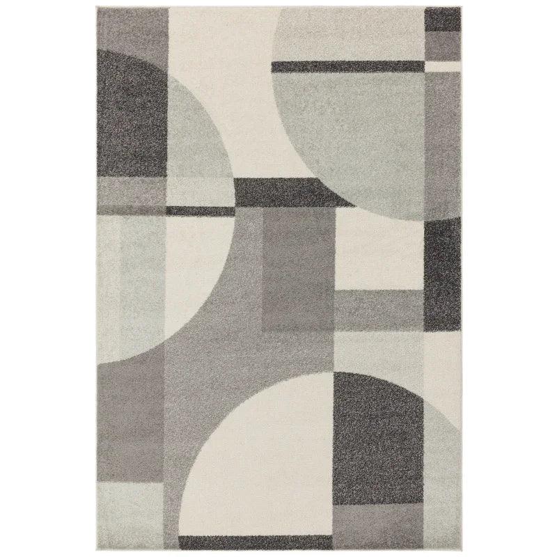 Grey geometric area rug with overlapping circles and rectangles pattern