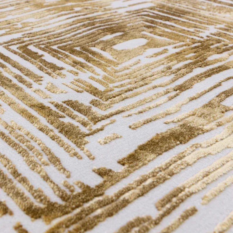Beige and gold geometric pattern rug with textured pile close-up