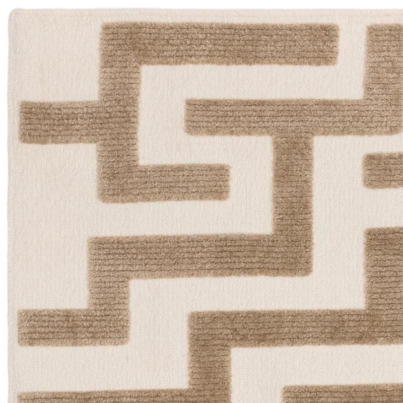 Beige and cream geometric patterned rug with textured wool surface