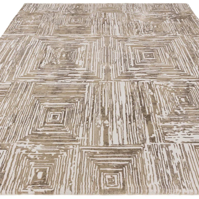 Beige geometric patterned area rug with textured square design on white background