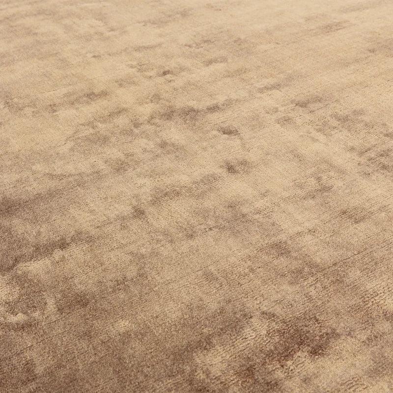 Beige textured area rug with soft pile and subtle pattern