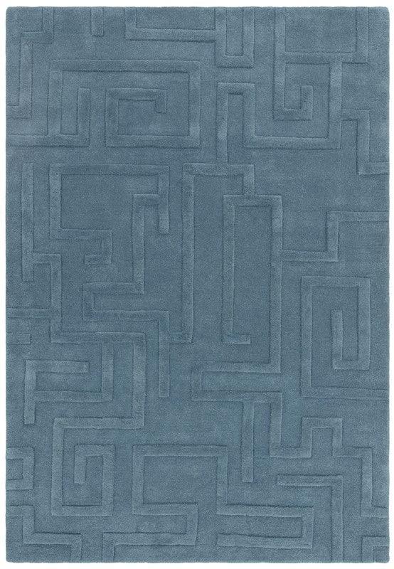 Blue area rug with geometric maze pattern and raised texture, rectangular shape