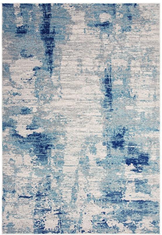 Blue abstract area rug with textured pattern and soft pile, viewed from above