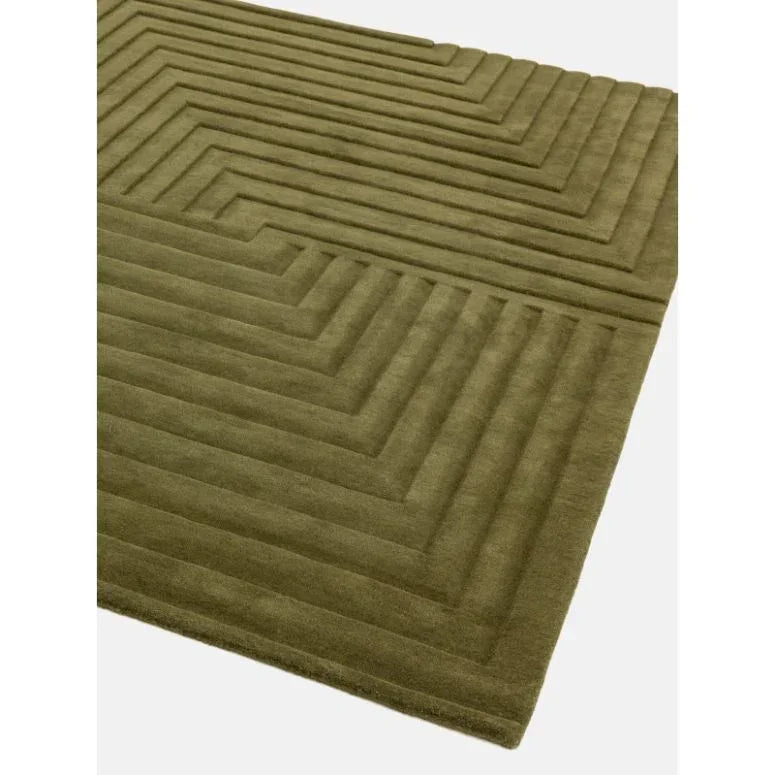 Modern olive green rug with raised geometric pattern and soft texture, corner angle view