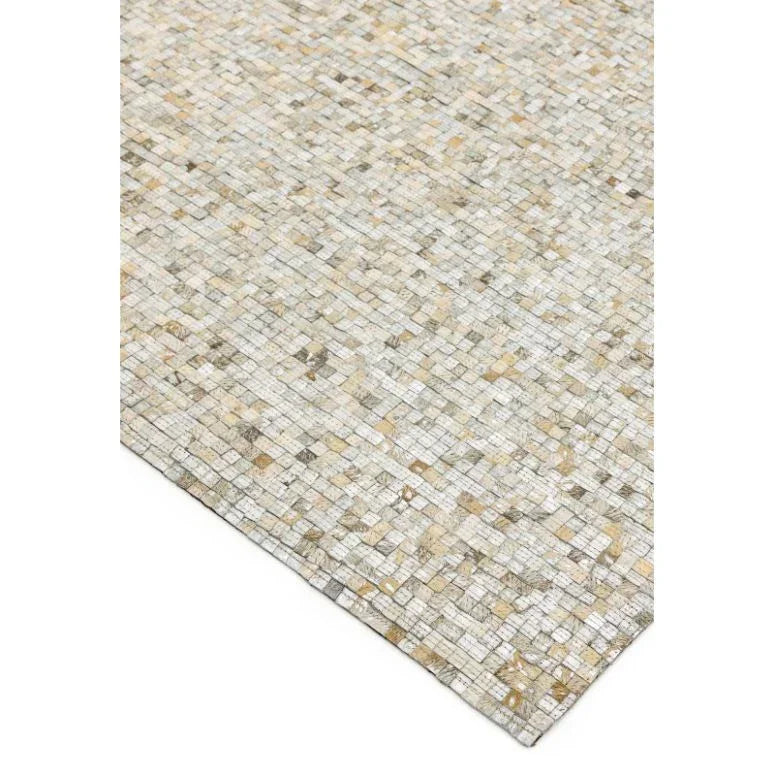 Beige and cream mosaic area rug with a woven geometric pattern, corner angled view