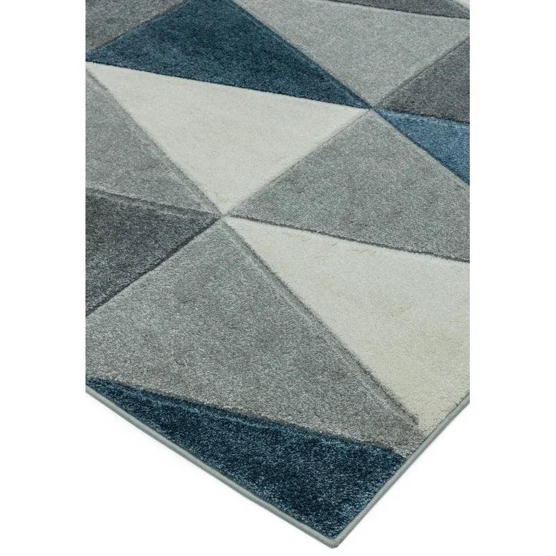 Modern area rug with geometric pattern in blue, grey, and cream tones