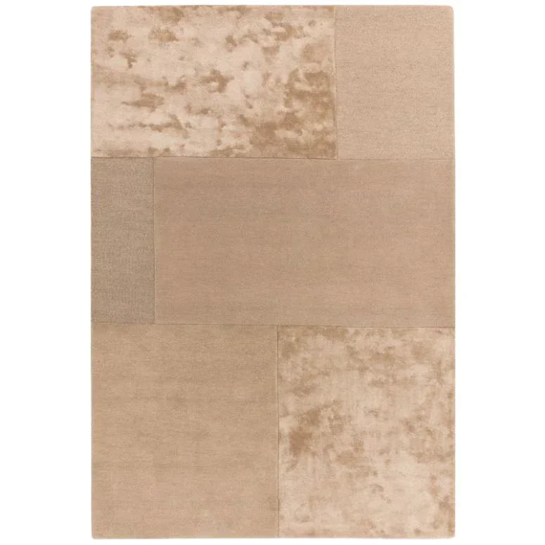 Beige patchwork area rug with varied textures and subtle block pattern design