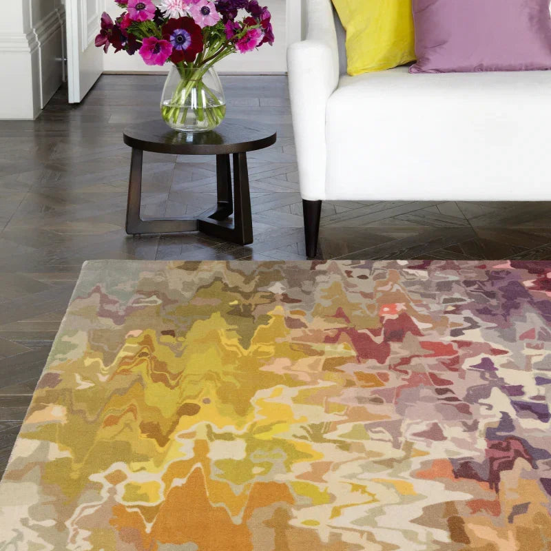 Modern multicolour abstract rug in living room with white sofa and side table