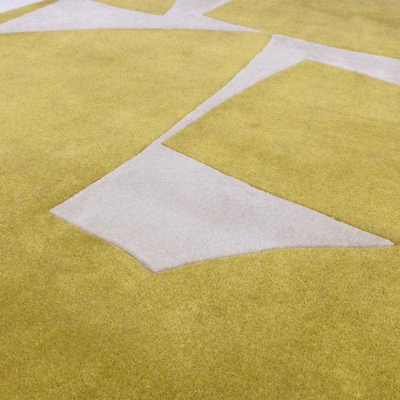 Yellow and cream geometric area rug with cut pile detail