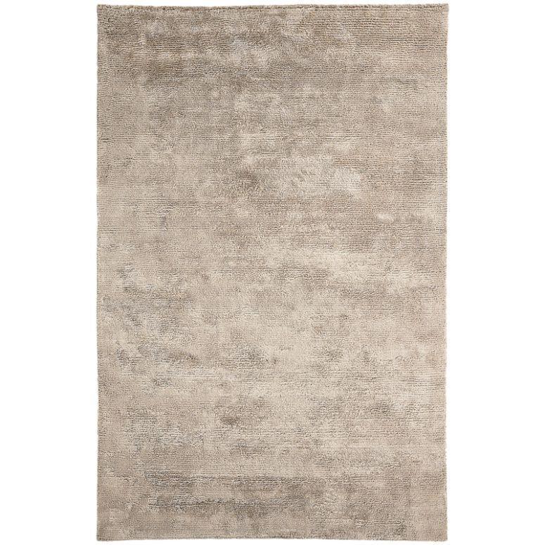 Beige area rug with subtle textured pattern and soft surface