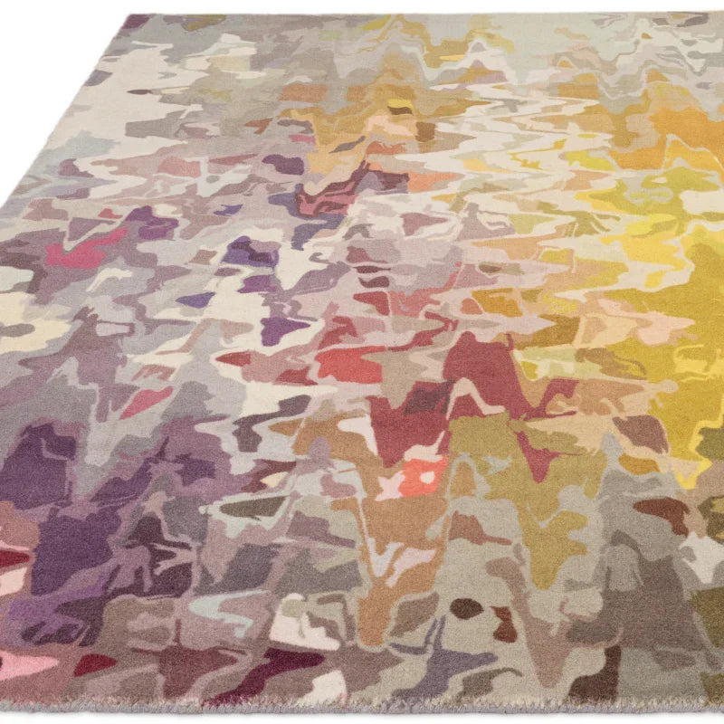Abstract area rug with purple, yellow, and beige geometric pattern, angled corner view