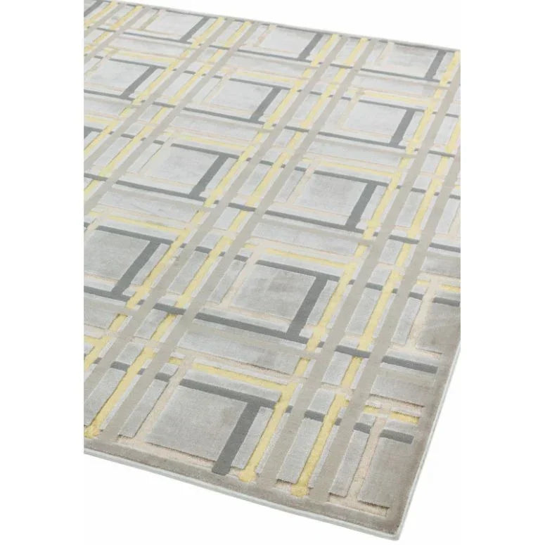 Grey and yellow geometric rug with intersecting line pattern, angled corner view