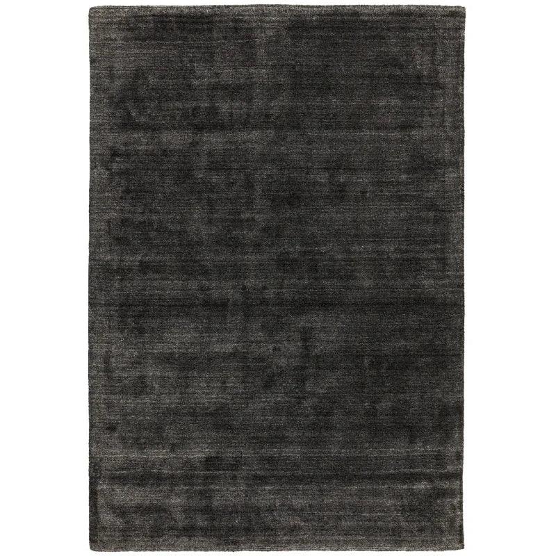 large rectangular charcoal area rug with subtle texture