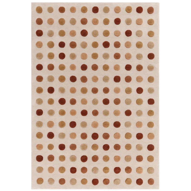 Beige area rug with brown and tan polka dot pattern, rectangular design, top view
