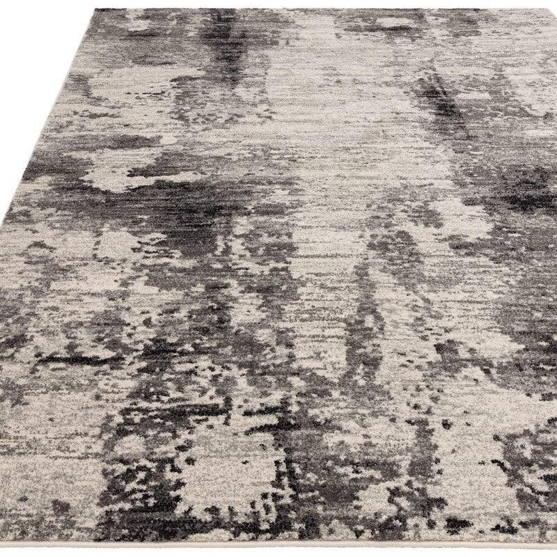 Modern grey area rug with abstract distressed pattern and soft texture
