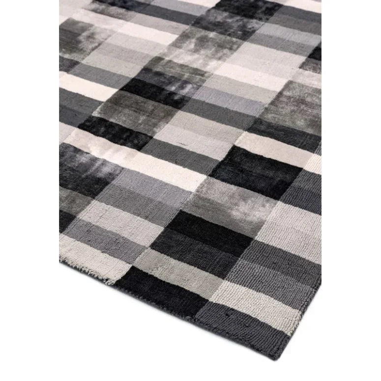 Rectangular grey checkered rug with soft pile and modern geometric pattern