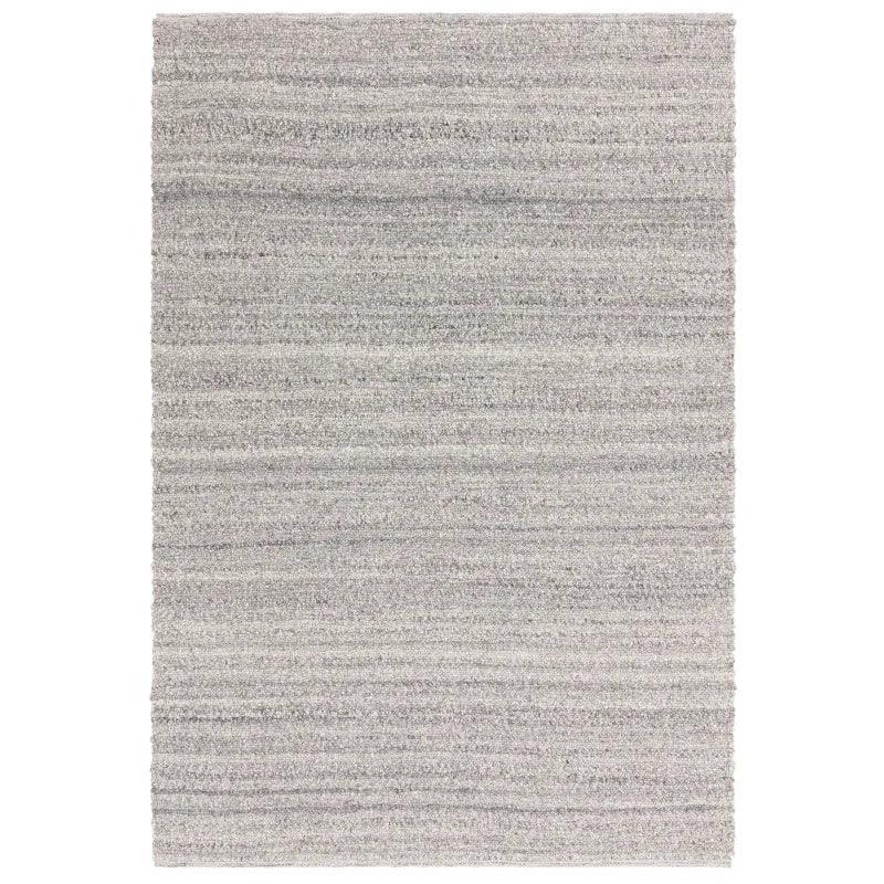 Light grey area rug with subtle striped texture and soft pile, shown from top view