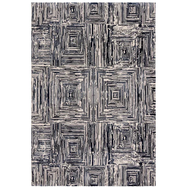 Geometric patterned area rug in navy and cream with square abstract design
