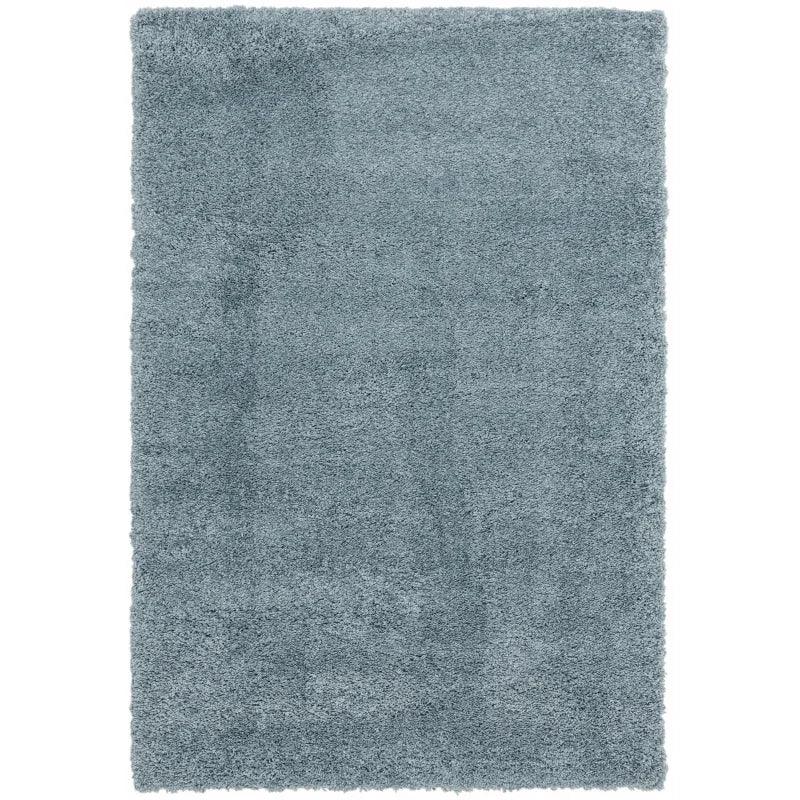 Light blue shaggy rug with thick pile and rectangular shape