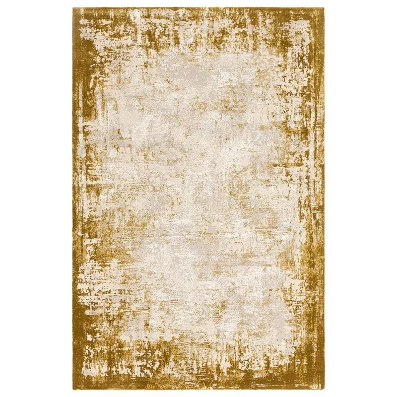 Distressed gold and cream area rug with abstract textured pattern
