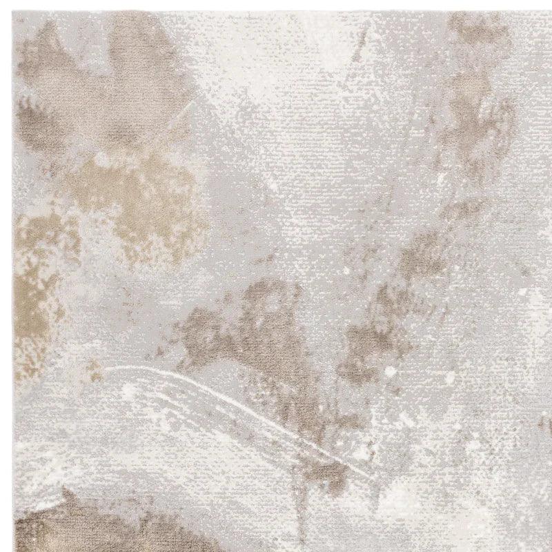 Neutral abstract area rug with beige and grey pattern, close-up of textured carpet surface