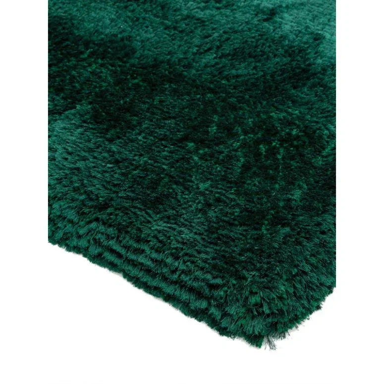 Deep green fluffy rug close-up showing soft pile texture