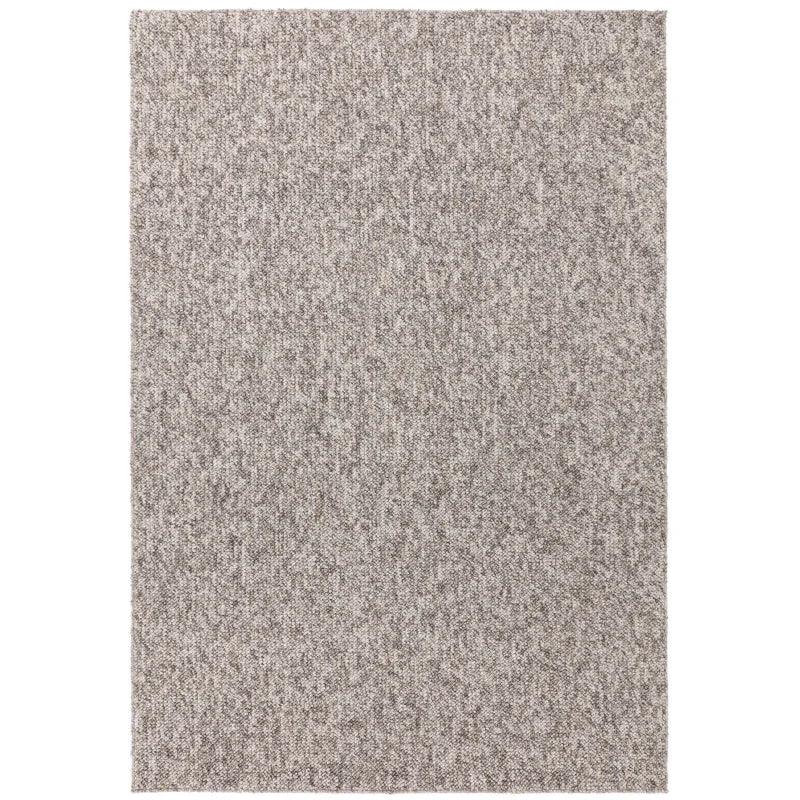 Rectangular grey textured area rug with subtle speckled pattern