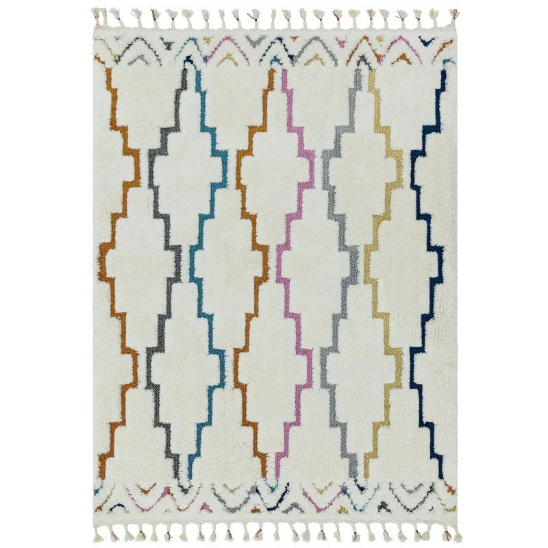 White geometric rug with multicolour zigzag stripes and tassel fringe