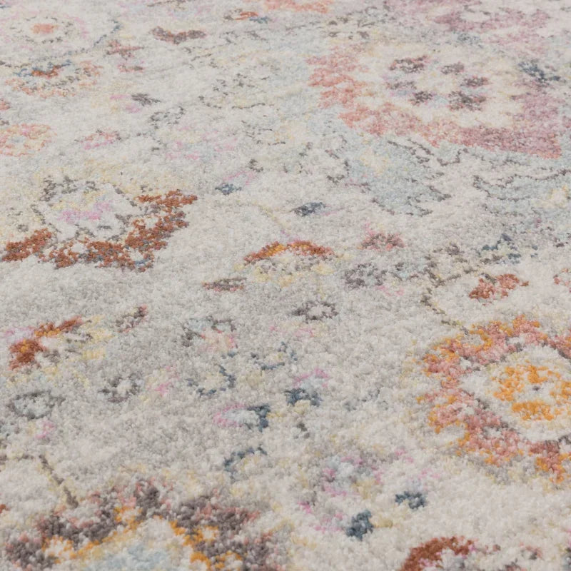 Close up of multicolour patterned rug with soft textured pile