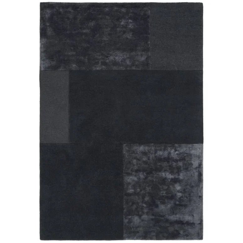 Charcoal black area rug with geometric block pattern and plush texture