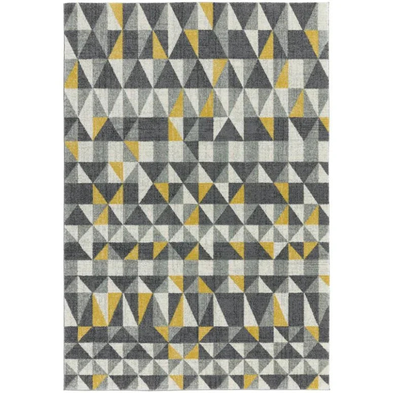 Geometric area rug with grey, yellow, and white triangle pattern