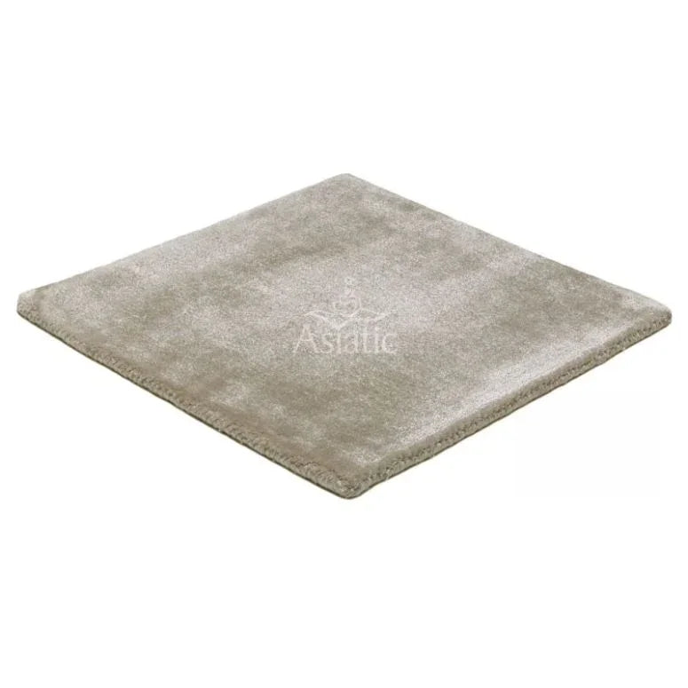 Beige plush area rug square with soft pile and finished edges on white background