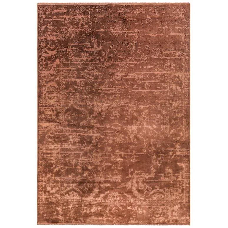 Rectangular brown area rug with subtle distressed pattern and soft texture