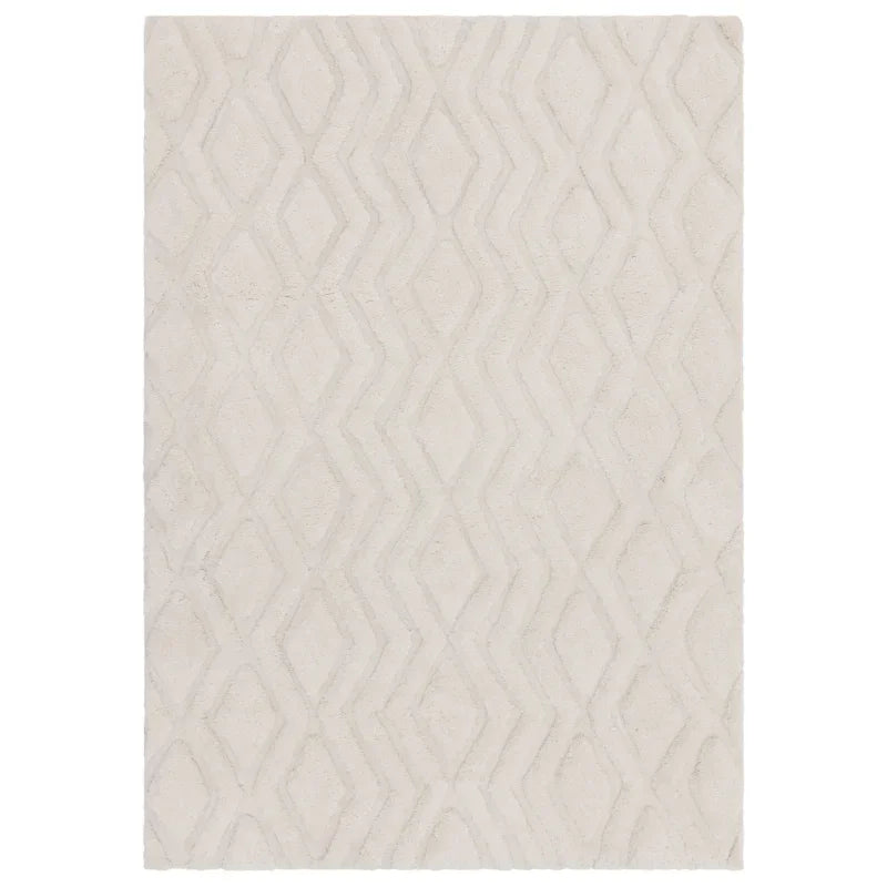 Ivory textured rug with geometric diamond pattern and soft pile