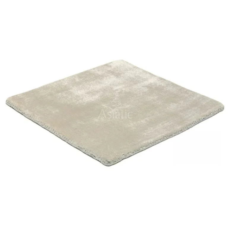Square light grey rug with soft pile and finished edges, shown on white background