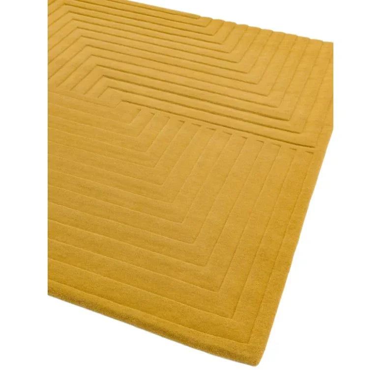 Mustard yellow geometric wool rug with raised pattern, corner view