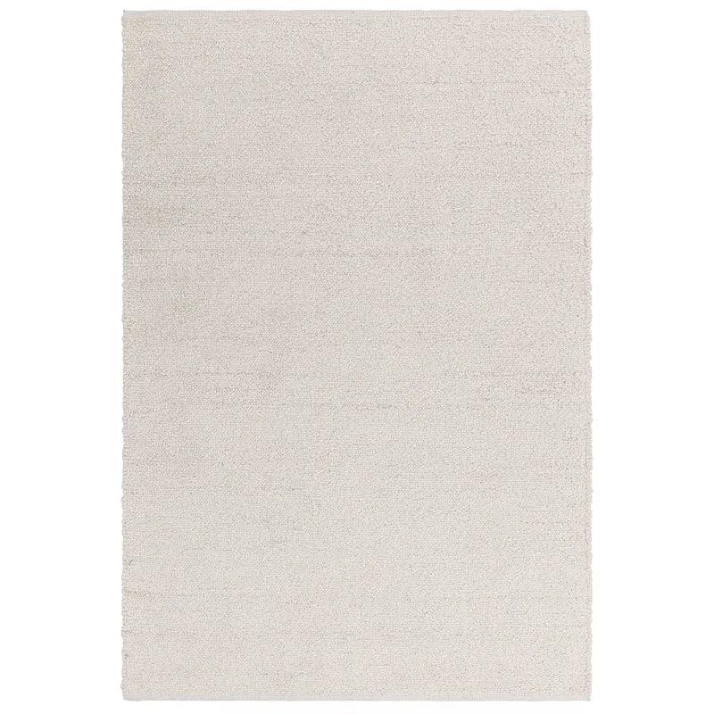 Large rectangular cream rug with soft textured pile on white background