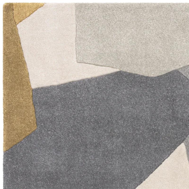 Modern area rug with abstract geometric pattern in grey, beige, cream and gold tones