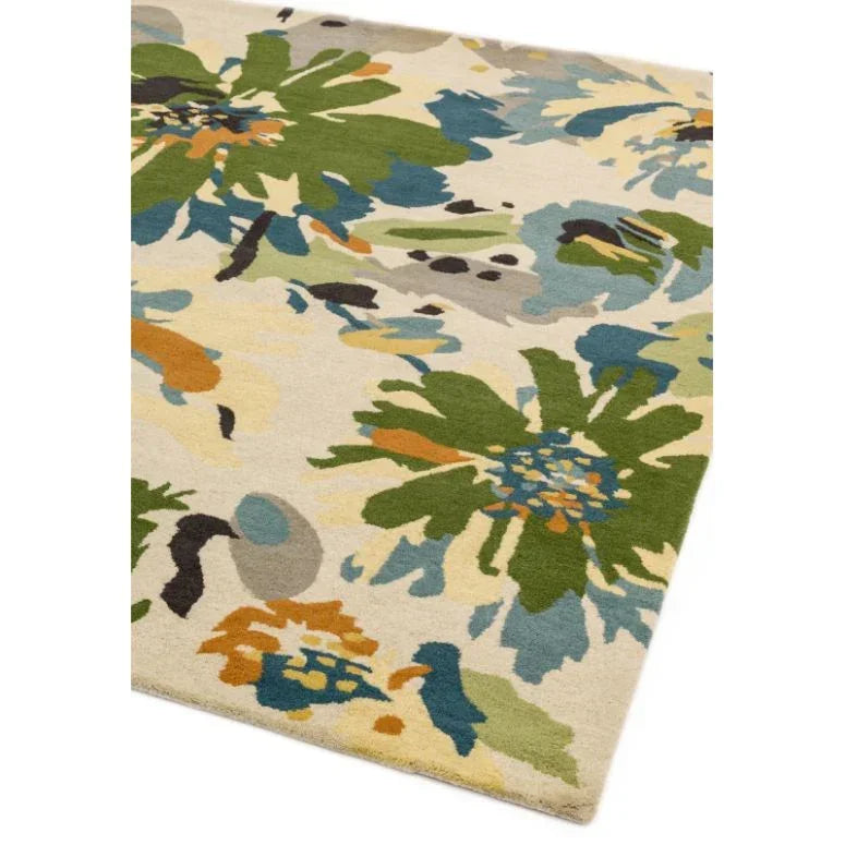 Floral patterned area rug with green, blue, and orange accents on a cream background