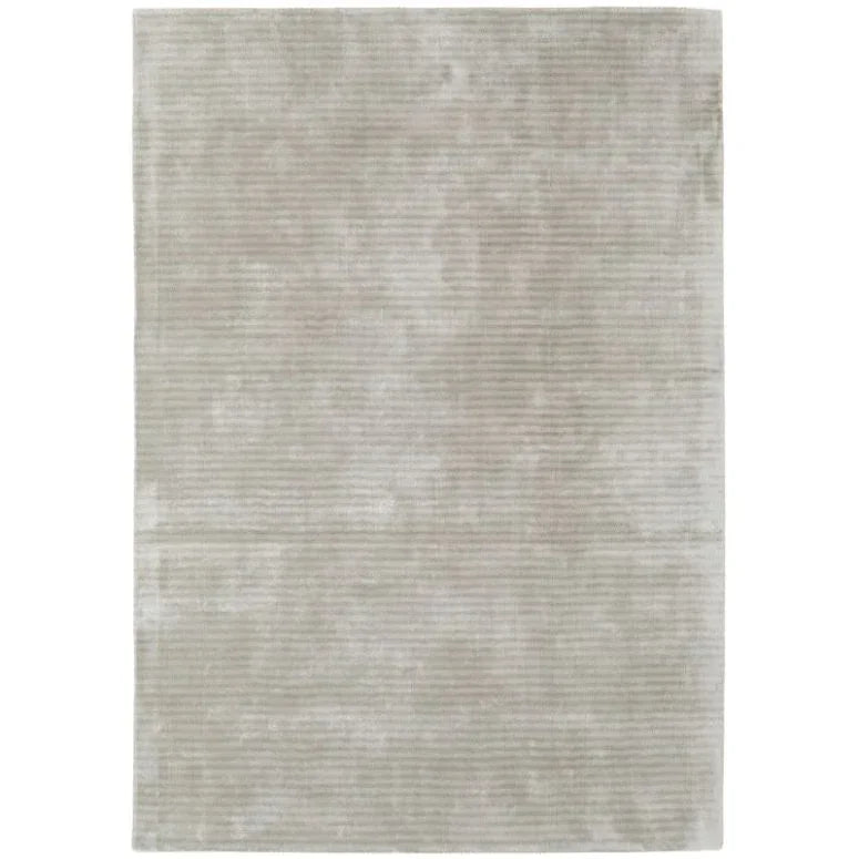 Large rectangular beige rug with subtle textured stripes, viewed from above