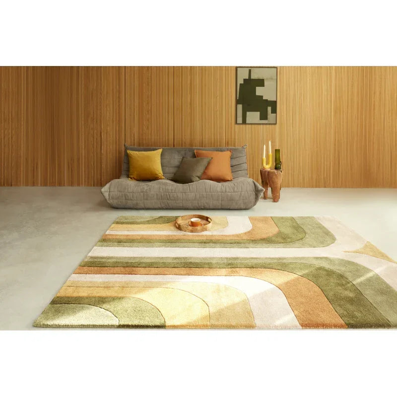 Modern living room with patterned area rug, grey sofa and yellow accent cushions