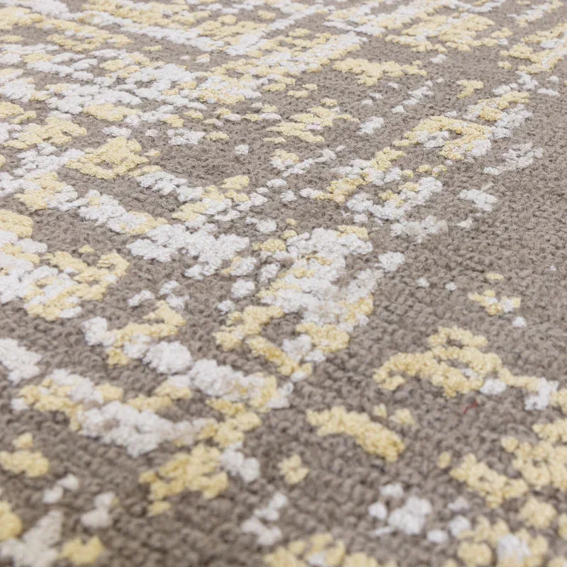 Closeup of beige and yellow area rug with textured woven pattern