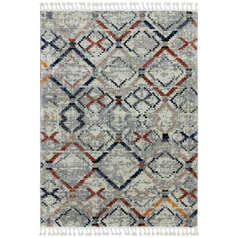 Geometric patterned area rug with fringe, in grey, orange, and navy tones