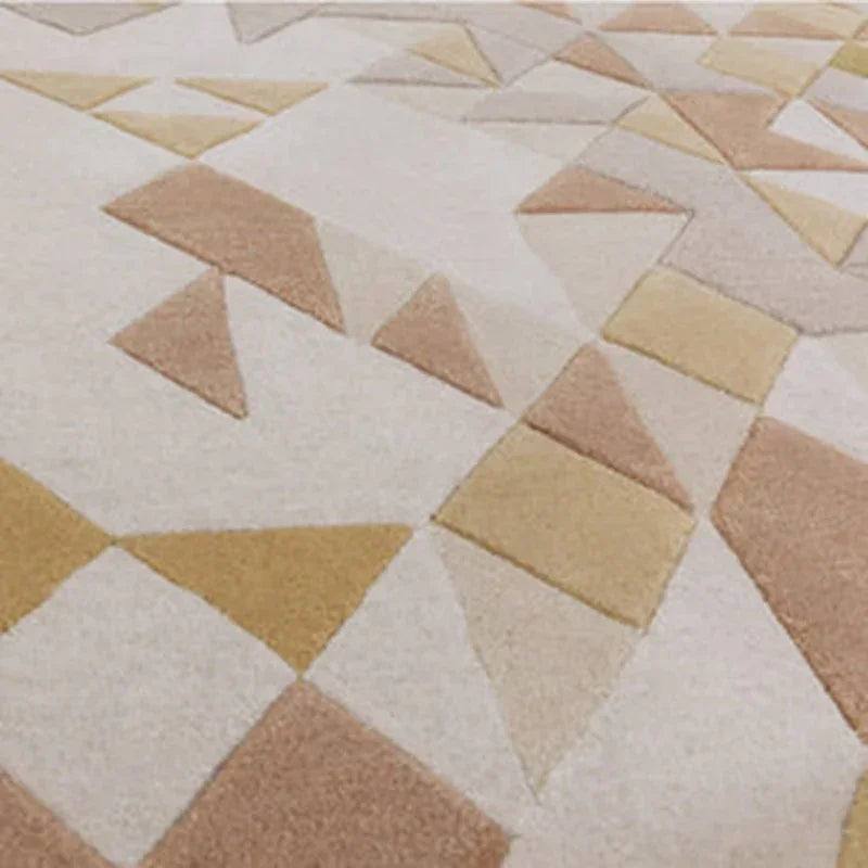 Geometric area rug with beige, mustard, and taupe triangles and rectangles