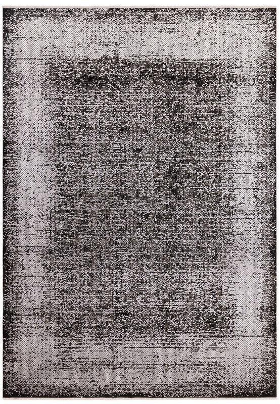 Black and white abstract area rug with distressed pattern and textured border