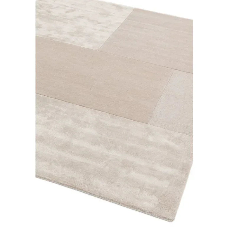 Beige geometric area rug with soft rectangular patterns and low-pile texture