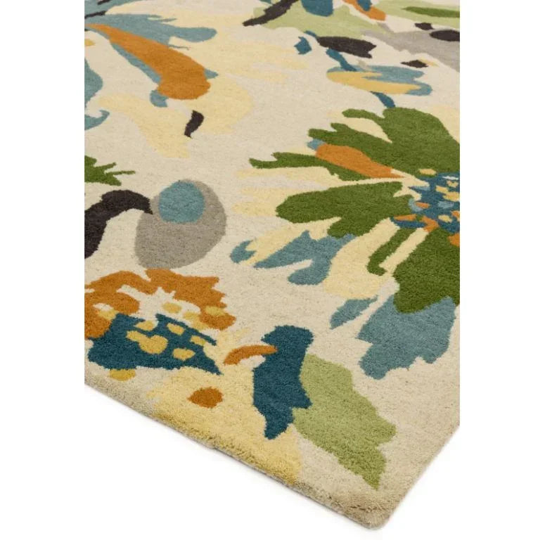 Floral pattern area rug with multicolored abstract design on cream background, corner view