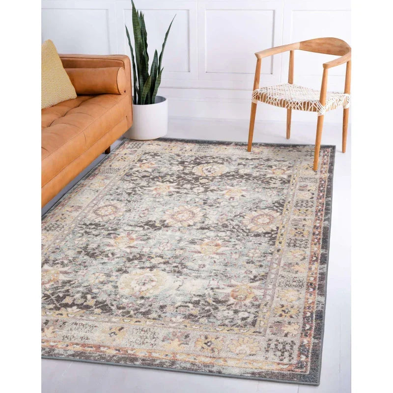Traditional patterned area rug with muted earth tones in modern living room setting