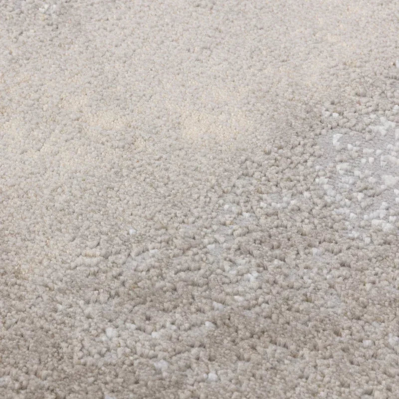 Close view of beige textured carpet with soft pile surface